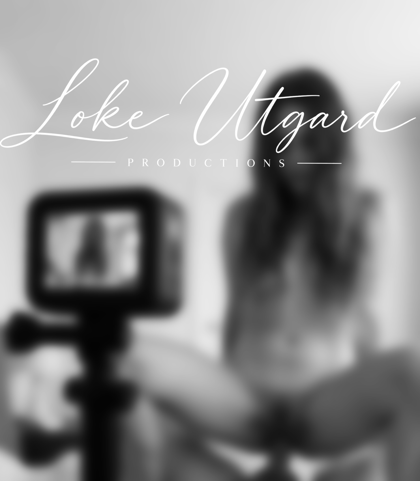 A camera filming a softly blurred production scene