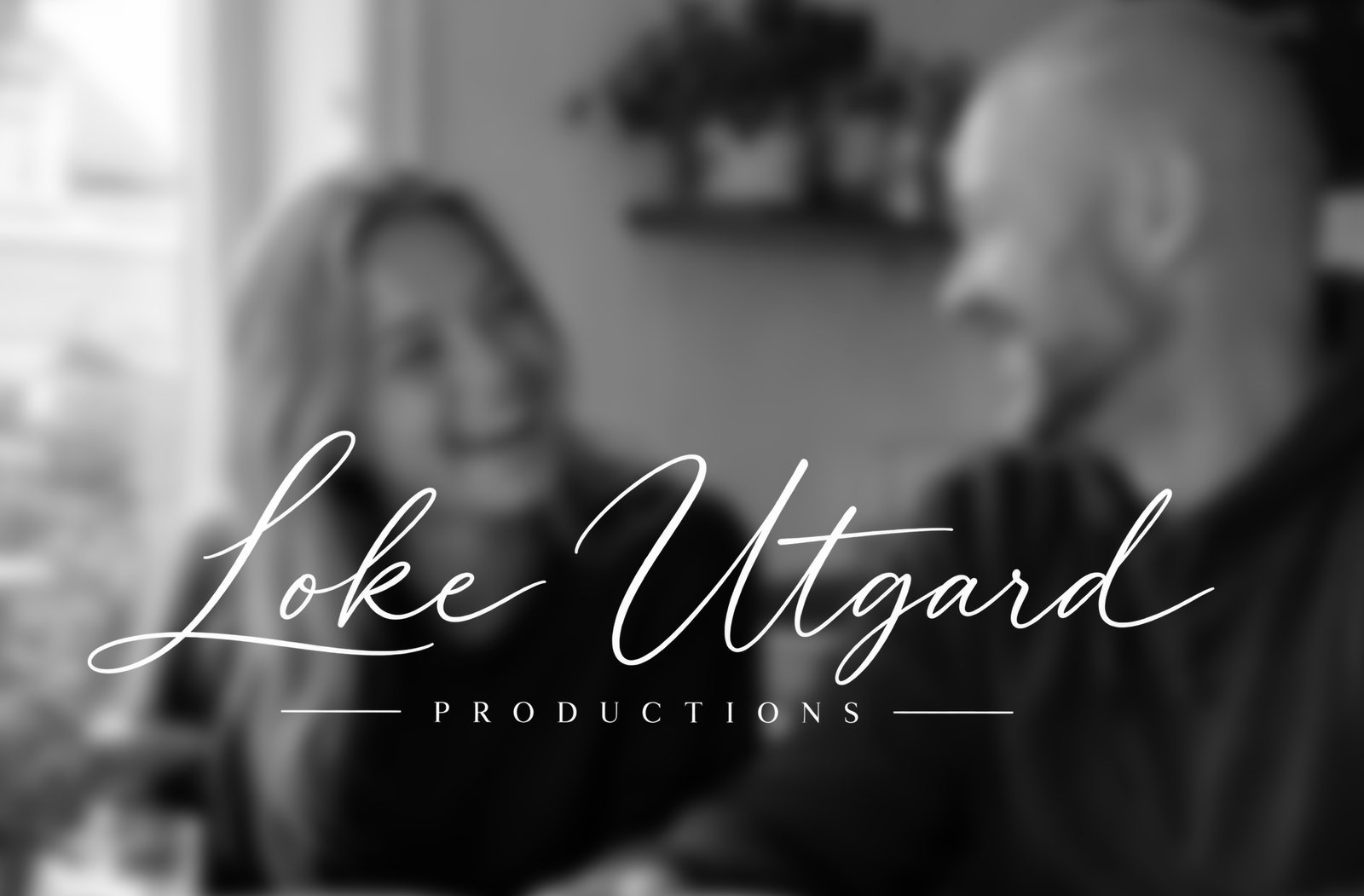 Two people talking comfortably during a small production